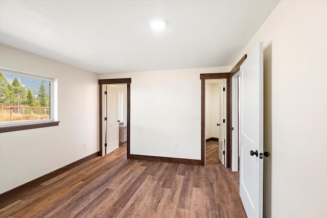 empty room featuring dark hardwood / wood-style floors