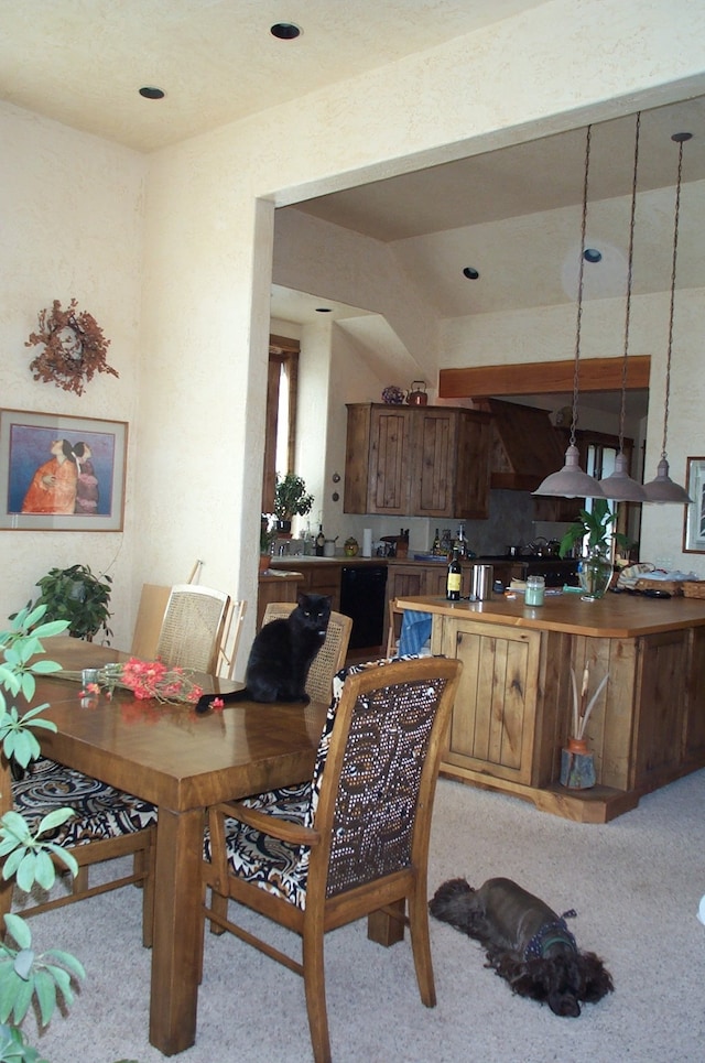 dining area featuring light carpet