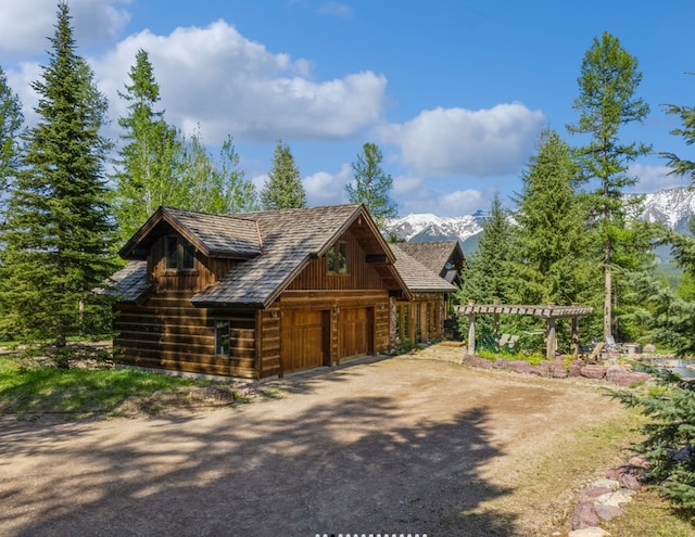1350 Summit Park, Seeley Lake, MT 59868 - exterior space with driveway, a garage, and a mountain view