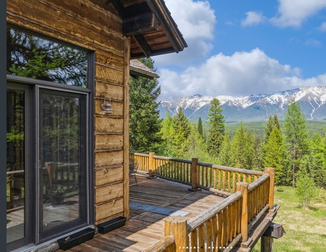 wooden deck featuring a mountain view