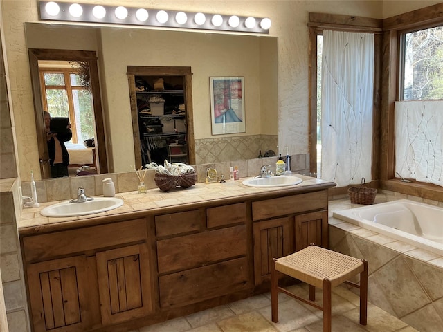 1350 Summit Park, Seeley Lake, MT 59868 - bathroom with ensuite bathroom, double vanity, and tiled tub