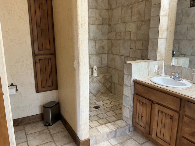 1350 Summit Park, Seeley Lake, MT 59868 - bathroom with walk in shower, vanity, baseboards, and a textured wall