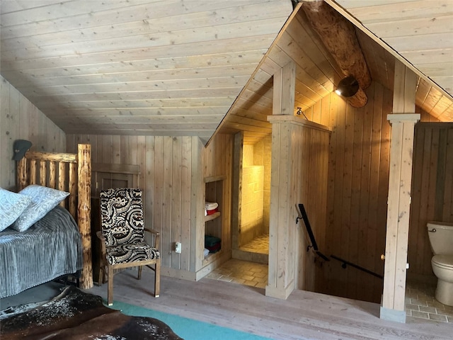 1350 Summit Park, Seeley Lake, MT 59868 - bedroom featuring lofted ceiling, wood finished floors, wood walls, wood ceiling, and connected bathroom