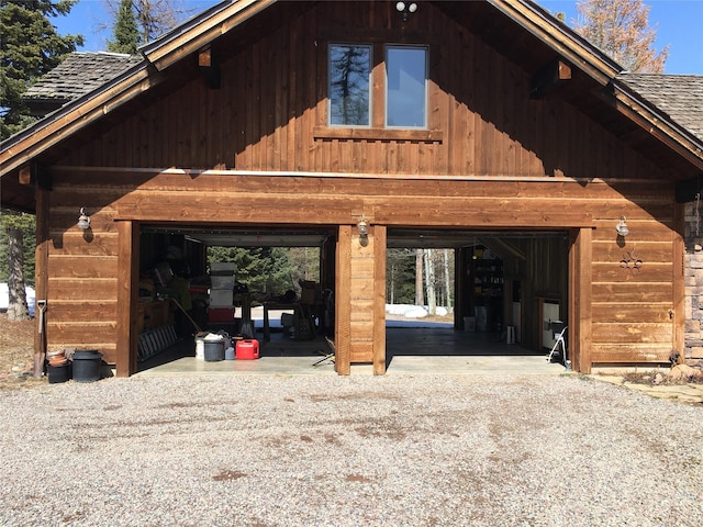 1350 Summit Park, Seeley Lake, MT 59868 - view of home's exterior with a garage, driveway, and roof with shingles