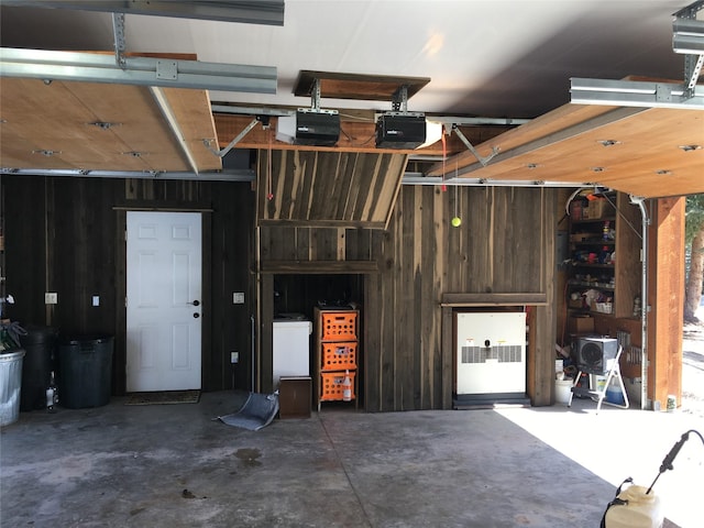 1350 Summit Park, Seeley Lake, MT 59868 - garage with a garage door opener and wooden walls