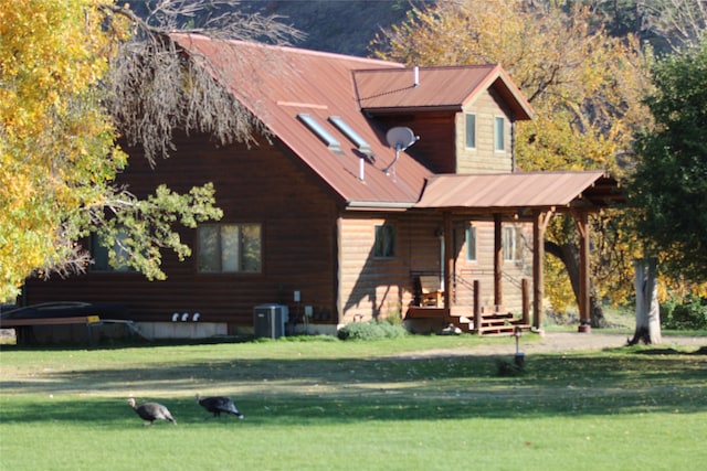 view of property exterior with a yard and cooling unit