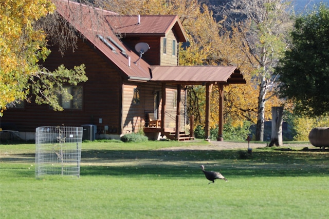 26 N Cooper Ln, Cascade, MT 59421 - exterior space with covered porch, metal roof, central air condition unit, and a lawn
