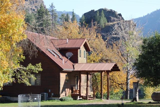 26 N Cooper Ln, Cascade, MT 59421 - exterior space with central air condition unit, a porch, metal roof, and a lawn