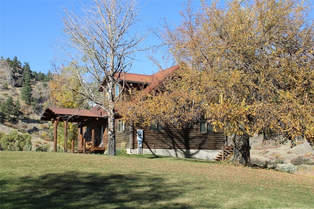 26 N Cooper Ln, Cascade, MT 59421 - view of property exterior featuring a yard and log siding