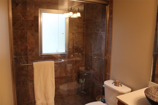 full bathroom with vanity, toilet, and shower / bath combination with glass door