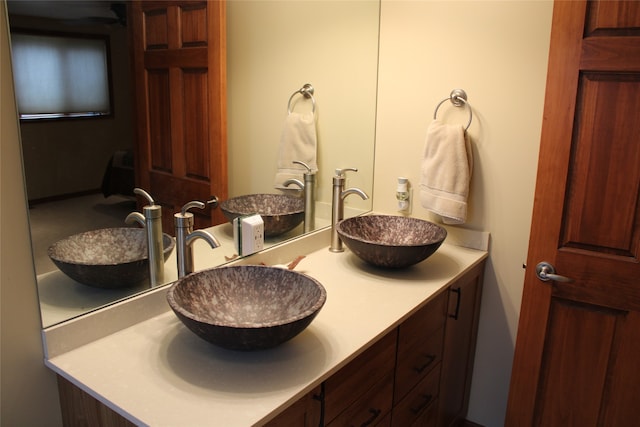 full bathroom with vanity, toilet, and shower / bath combination with glass door