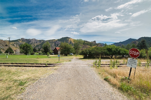 view of yard with a water and mountain view