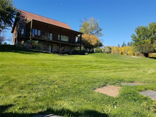 26 N Cooper Ln, Cascade, MT 59421 - rear view of house with a yard and metal roof