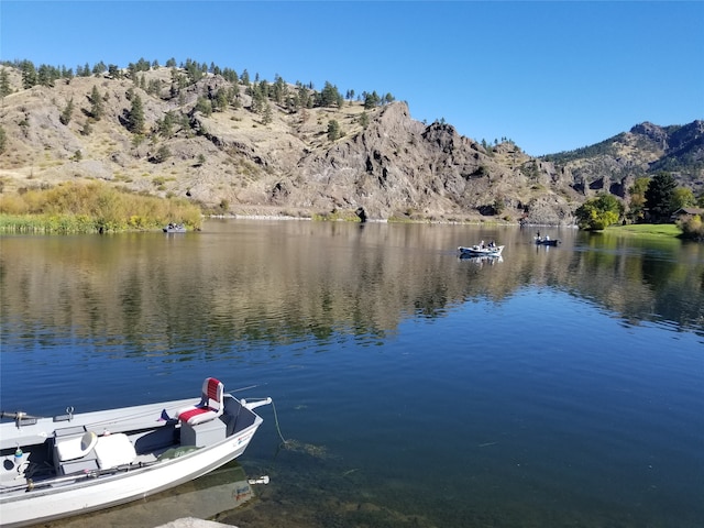 dock area with a water and mountain view