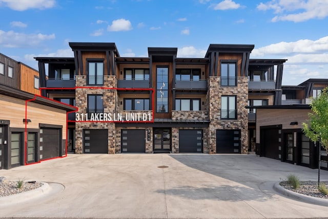 view of building exterior featuring a garage and driveway