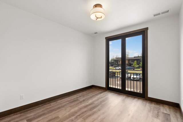 311 Akers Ln Unit D, Whitefish, MT 59937 - unfurnished room with baseboards and wood finished floors