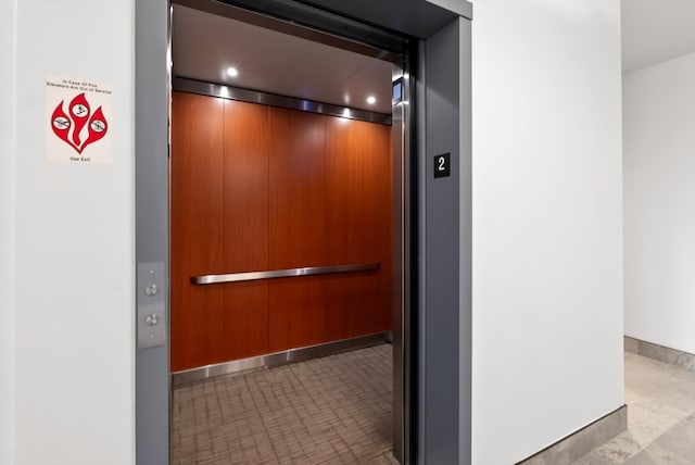 interior details with elevator and baseboards