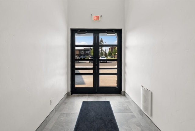 311 Akers Ln Unit D, Whitefish, MT 59937 - doorway featuring french doors, concrete floors, and baseboards