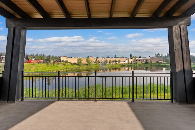 view of patio / terrace featuring a water view and a residential view