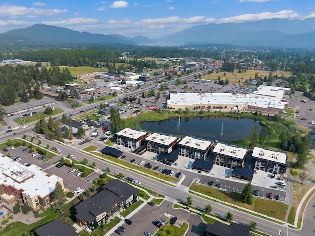 aerial view featuring a water and mountain view