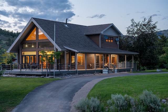 view of front of home with a front lawn and a porch