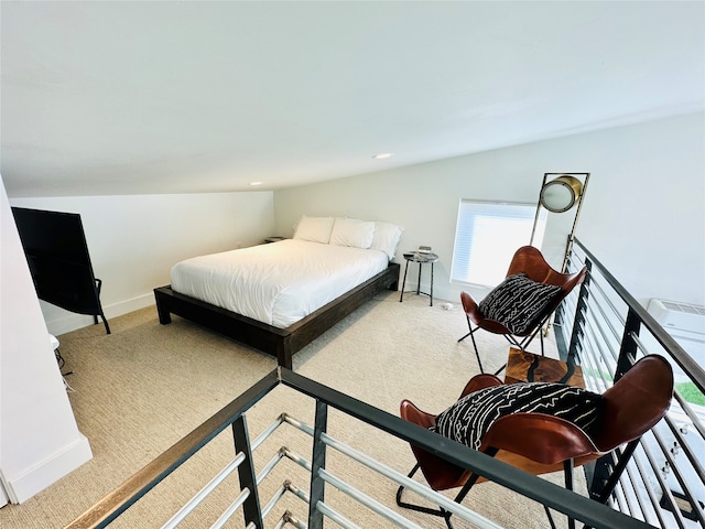 bedroom featuring light carpet and vaulted ceiling