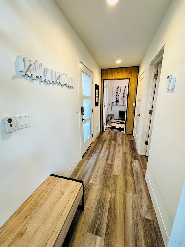 corridor featuring dark hardwood / wood-style flooring