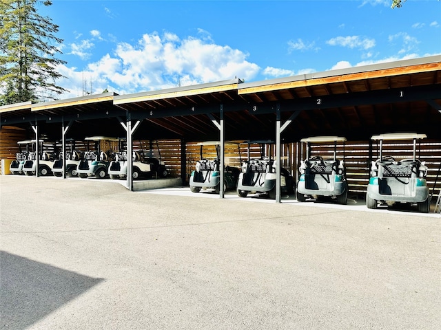 view of vehicle parking with a carport