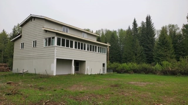 view of home's exterior with a lawn