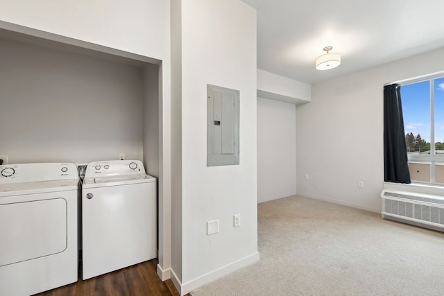 washroom featuring independent washer and dryer, carpet, and radiator heating unit