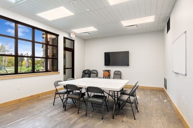 dining area with wood-type flooring