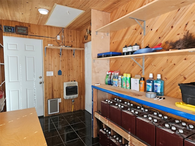 kitchen with wooden walls and heating unit