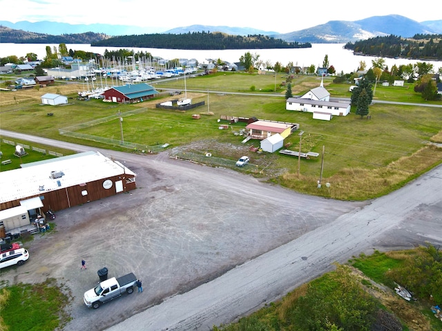 drone / aerial view with a water and mountain view