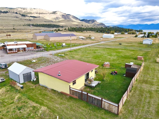 birds eye view of property featuring a mountain view and a rural view