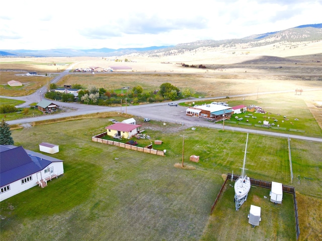 birds eye view of property featuring a mountain view and a rural view