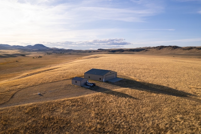 exterior space with a rural view and a mountain view