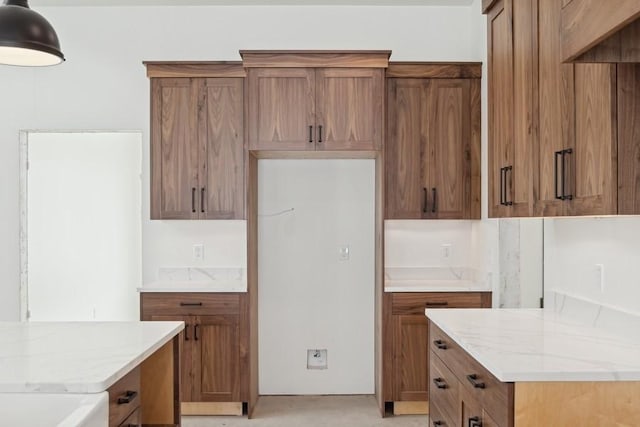 kitchen featuring light stone counters