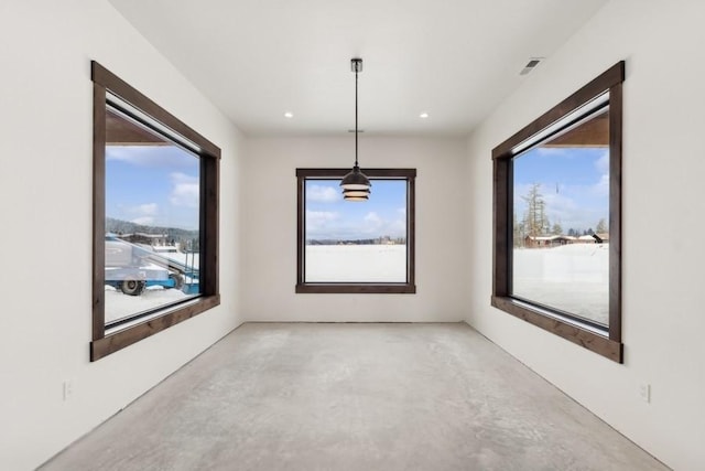 unfurnished dining area featuring a wealth of natural light