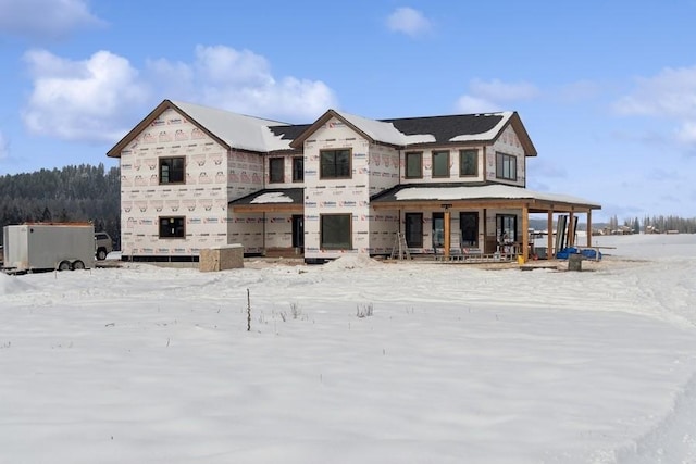 unfinished property featuring a porch