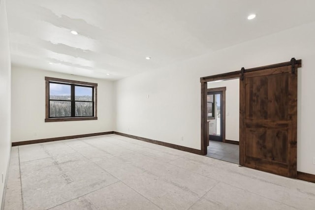 empty room featuring a barn door