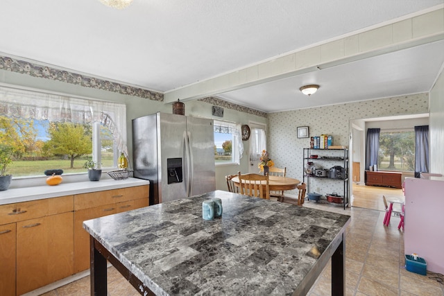 kitchen with stainless steel refrigerator with ice dispenser