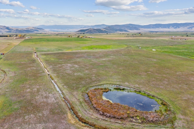 bird's eye view with a rural view and a water and mountain view