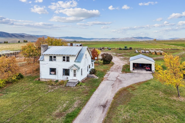 bird's eye view featuring a rural view and a mountain view