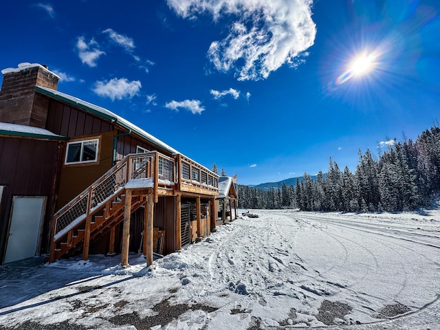 425 Lagger Gulch Rd, Anaconda, MT 59711 - snowy yard with stairs and a deck with mountain view