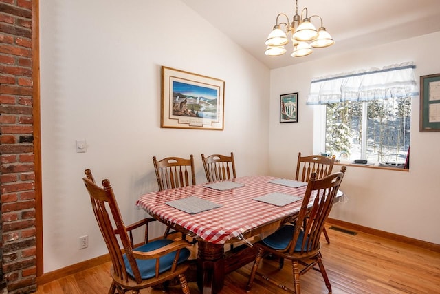 425 Lagger Gulch Rd, Anaconda, MT 59711 - dining space featuring baseboards, light wood-style floors, an inviting chandelier, and visible vents