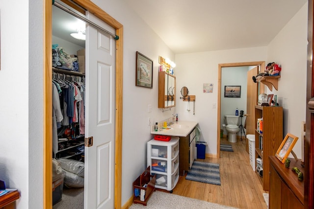 425 Lagger Gulch Rd, Anaconda, MT 59711 - hall with baseboards, light wood-type flooring, and a sink