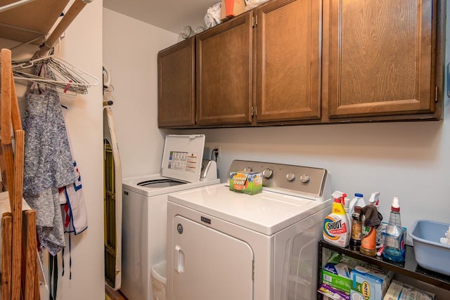 425 Lagger Gulch Rd, Anaconda, MT 59711 - clothes washing area featuring washing machine and dryer and cabinet space