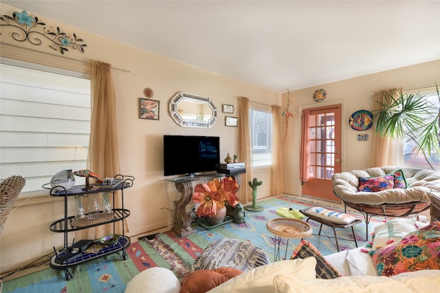 living room featuring baseboards