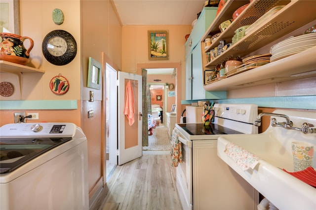 kitchen featuring light wood finished floors, open shelves, white range with electric cooktop, washer / clothes dryer, and a sink