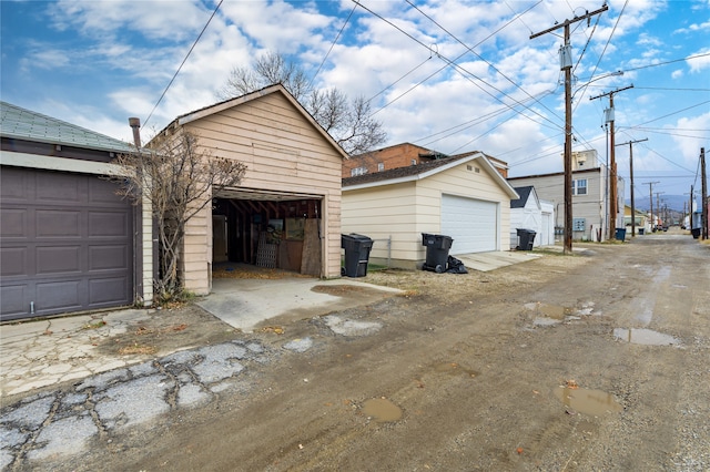 view of side of property featuring an outdoor structure and a garage